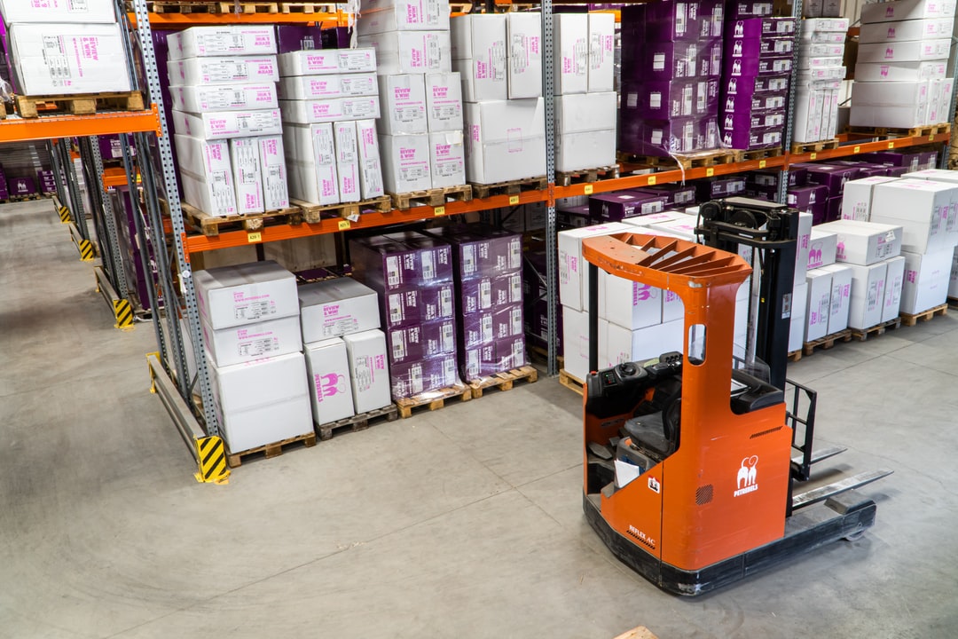 Efficient supply chain lead time in action with organized warehouse storage and forklift