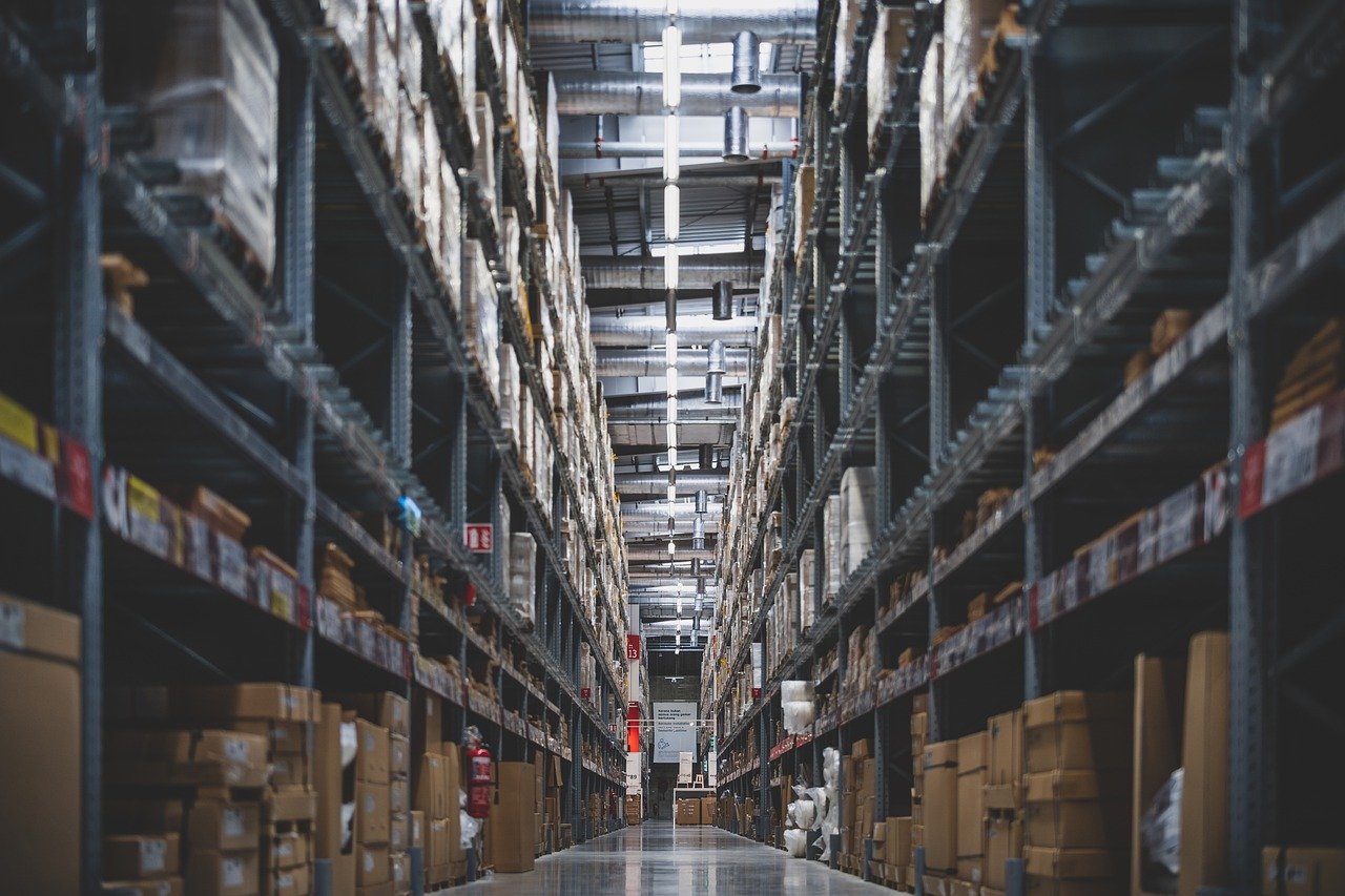 A warehouse stocked with products, emphasizing the importance of both service level and fill rate.