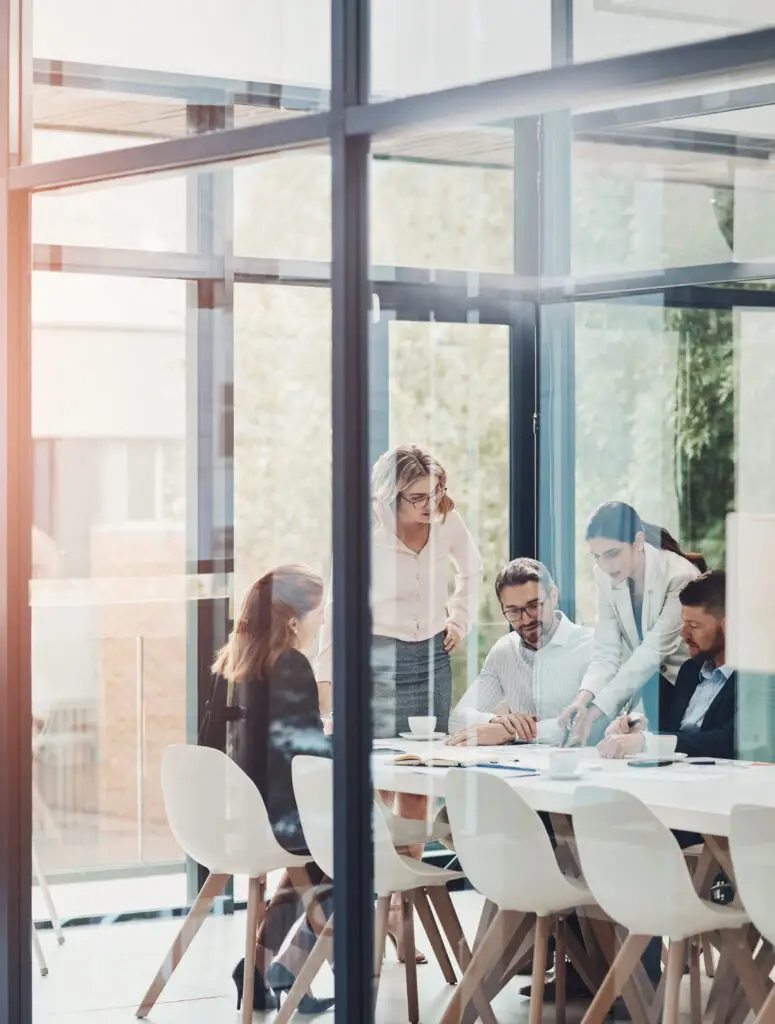 Window, business people or talking in meeting for paperwork, teamwork or collaboration together. Entrepreneur, investor or executive director speaking in discussion for feedback, planning or project