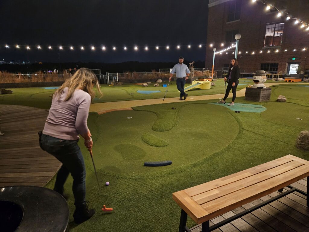 Post-event fun, playing mini putt putt